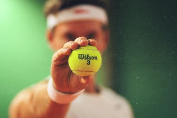 Man holding tennis ball