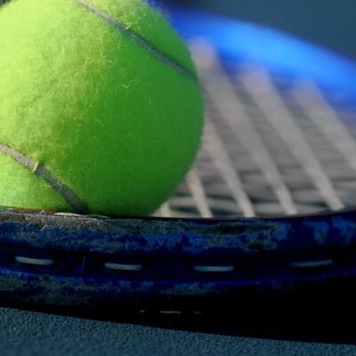 Tennis ball on tennis racket