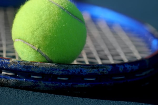 Tennis ball on tennis racket