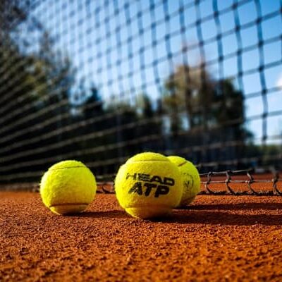 Tennis ball on clay court