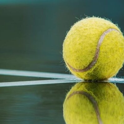 Tennis ball reflection on court