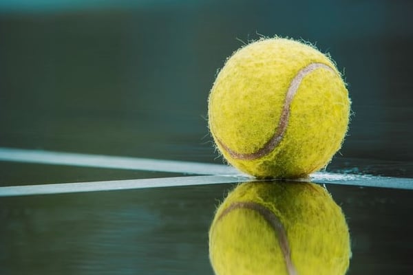 Tennis ball reflection on court