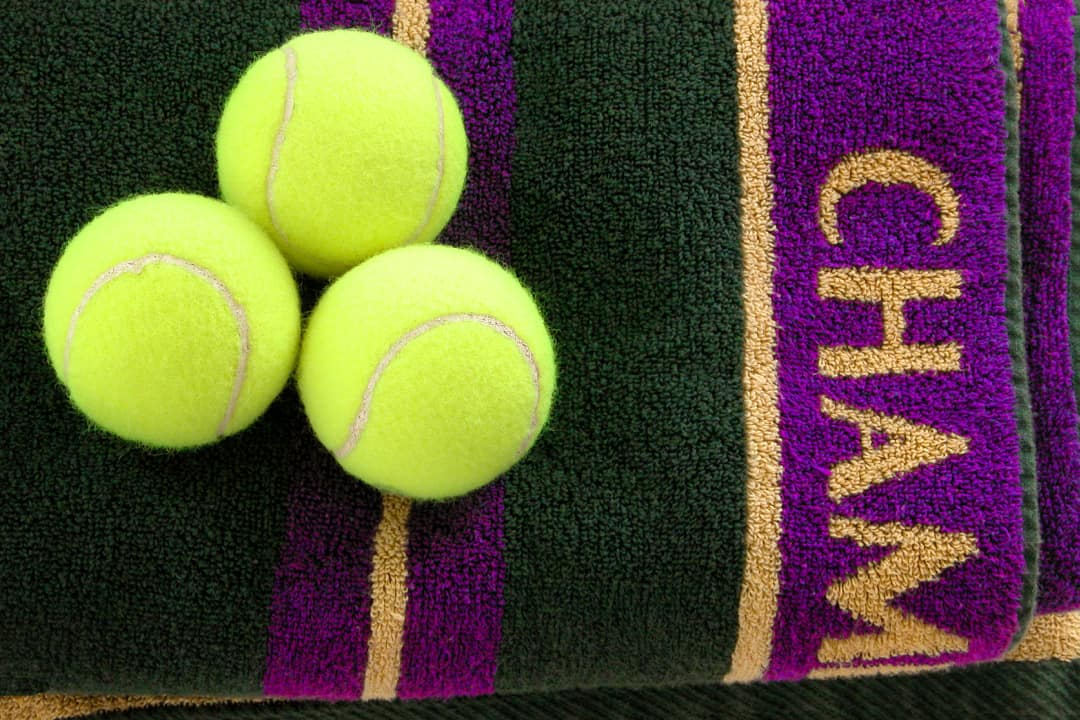 Wimbledon tennis balls on towel